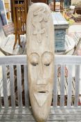 A Polynesian style carved wood mask, height 110cm