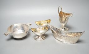A mixed collection of silver to include a Scottish quaich, a pair of George III boat shaped salts, a