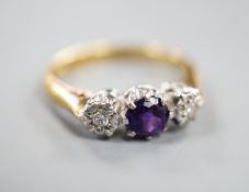An 18ct, singe stone amethyst and illusion set two stone diamond ring, size, O/P, gross weight 3.7