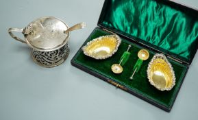 A Victorian pierced silver drum mustard, London, 1839 and a cased pair of silver salts with spoons.