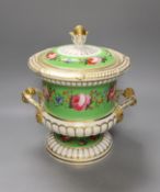 An English porcelain campana shaped ice pail and two covers painted with flowers and a green ground,