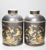 A pair of toleware style tea cannisters, 36 cms high.