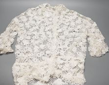 A 19th century hand made Irish crochet jacket, with long sleeves and high collar, a bobbin lace