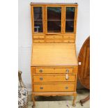 An early 20th century rosewood banded satinwood bureau bookcase, width 70cm, height 161cm