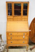 An early 20th century rosewood banded satinwood bureau bookcase, width 70cm, height 161cm