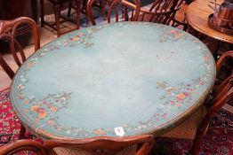 A Victorian breakfast table later painted green with floral decoration, length 143cm, depth 102cm,