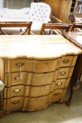 A 19th century Dutch pine Cupid’s bow shaped chest fitted four drawers, width 92cm, height 80cm