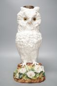 A large late 19th century ‘owl’ porcelain oil lamp base, with Victorian lozenge registration mark to