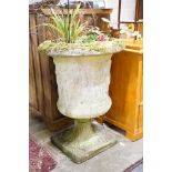 A reconstituted stone campana garden urn decorated with classical figures, height 86cm, diameter