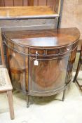 An early 20th century Maple & Co. mahogany demi-lune side cabinet with frieze drawer, width 84cm,