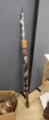 A 20th century Australian aboriginal spear and holder and 2 boomerangs.,Spear 142 cms long.