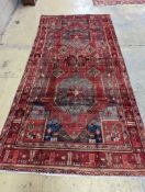 An Ardabil red ground carpet, 322 x 157cm