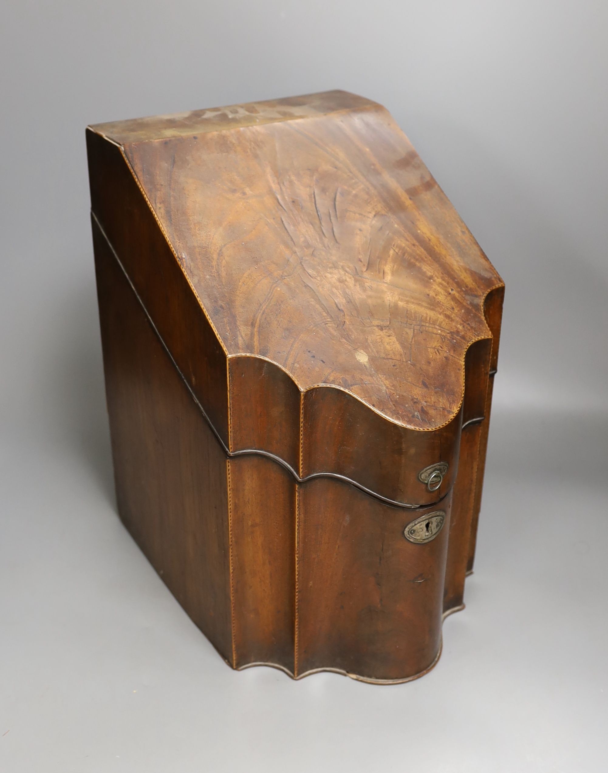 A George III mahogany and line inlaid knife box, 37 cms high.