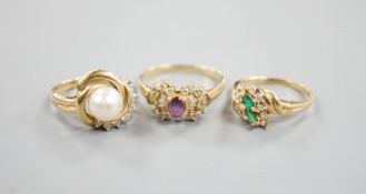 Three assorted modern 14k yellow metal and gem set dress rings, including cultured pearl and