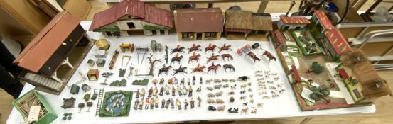 A collection of mainly Britains painted lead figures and animals, including huntsmen and hounds,