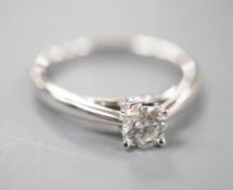 A modern 9k white metal and solitaire diamond ring, the stone weighing 0.33ct, size L, gross