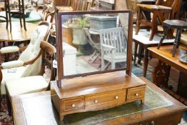 A Regency boxwood strung mahogany toilet mirror, width 62cm