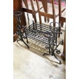 A group of wrought iron fireside effects including a pair of dogs, basket, 54 cm wide etc.