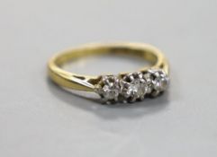 An 18ct & plat, three stone diamond set ring, size G/H, gross weight 2.2 grams.