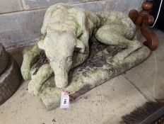 A reconstituted stone recumbent hound garden ornament, width 80cm, depth 42cm, height 44cm