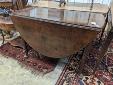 A George III oval mahogany drop leaf pad foot dining table, width 108cm, length 134cm extended,