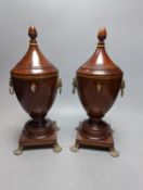 A pair of Sheraton-style mahogany urn-shape tea caddies, with brass mounts, 36cm.