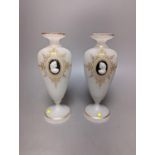Two cameo and gilt decorated vases, 23 cms high.