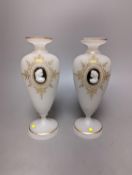 Two cameo and gilt decorated vases, 23 cms high.