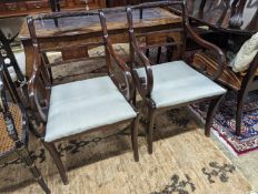 A pair of Regency style brass inlaid mahogany elbow chairs, width 48cm, depth 48cm, height 88cm