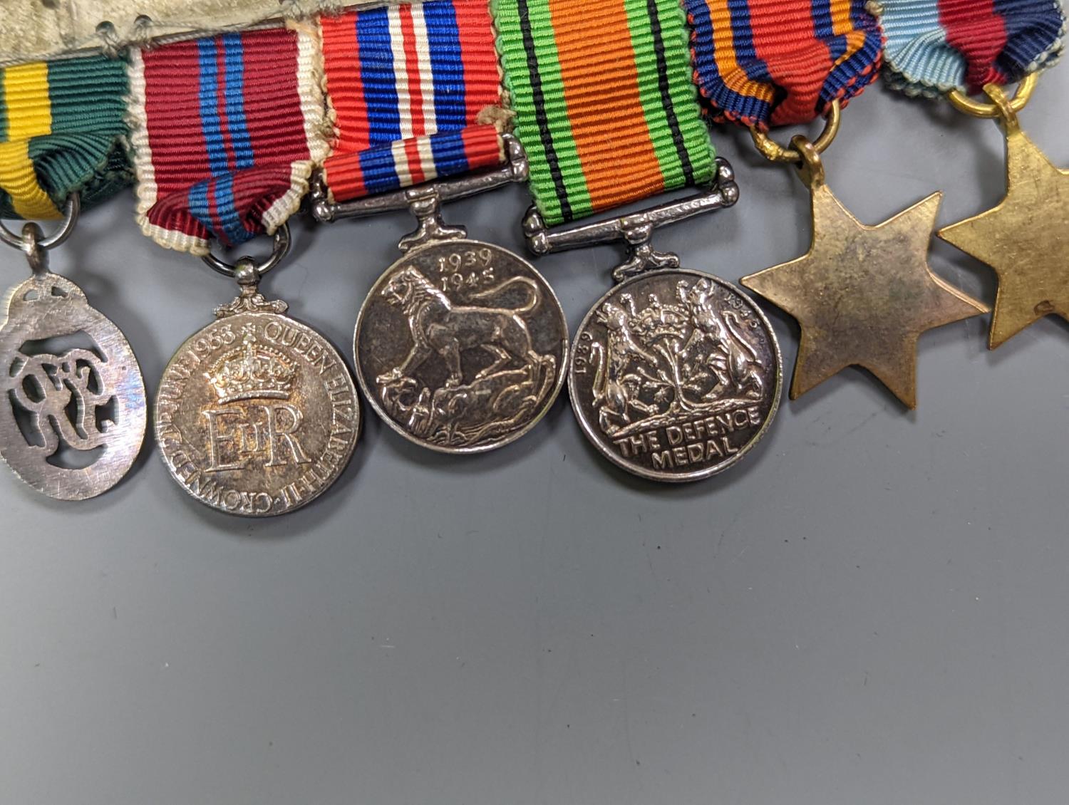 A WWII medal group of six, with miniatures, and a royal commemorative medal, 1937 - Image 14 of 15