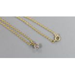 An 18ct gold and solitaire diamond set pendant, on an 198ct gold chain, chain 40cm, gross weight 2.7