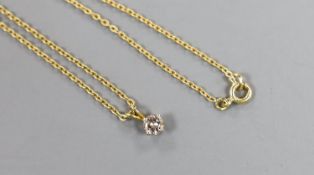 An 18ct gold and solitaire diamond set pendant, on an 198ct gold chain, chain 40cm, gross weight 2.7