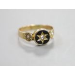 A Victorian yellow metal black enamel, seed pearl and diamond set mourning ring, size O/P, gross