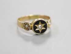A Victorian yellow metal black enamel, seed pearl and diamond set mourning ring, size O/P, gross