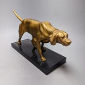 A gilt-metal model of a pointer on marble base 29cm