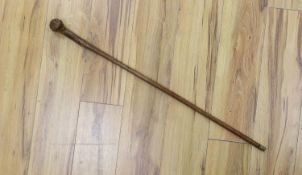 A 19th century folk art walking stick, 89 cms long.
