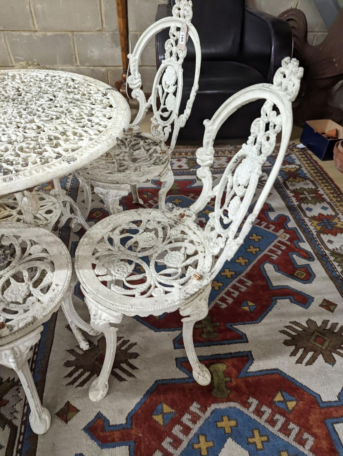 A Victorian style painted aluminium circular garden table, diameter 72cm, together with four chairs - Image 4 of 4