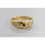 A late Victorian 18ct and three stone gem set ring, size L, gross weight 1.4 grams.