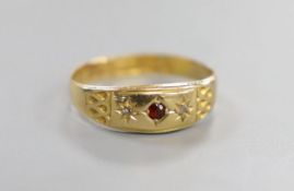 A late Victorian 18ct and three stone gem set ring, size L, gross weight 1.4 grams.