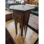 A Moorish mother of pearl and marquetry inlaid hexagonal occasional table, width 29cm, height 50cm