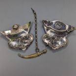 A 19th century Persian silver and niello belt buckle, 9cm. wide