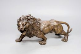 A bronze lion, bearing a signature, Rodin, 31cm.