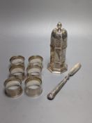 A set of six George V silver napkin rings, Birmingham, 1915, a silver sugar caster and silver butter