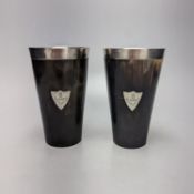 A pair of late Victorian silver mounted horn beakers, with crested shield appliques, John Newton