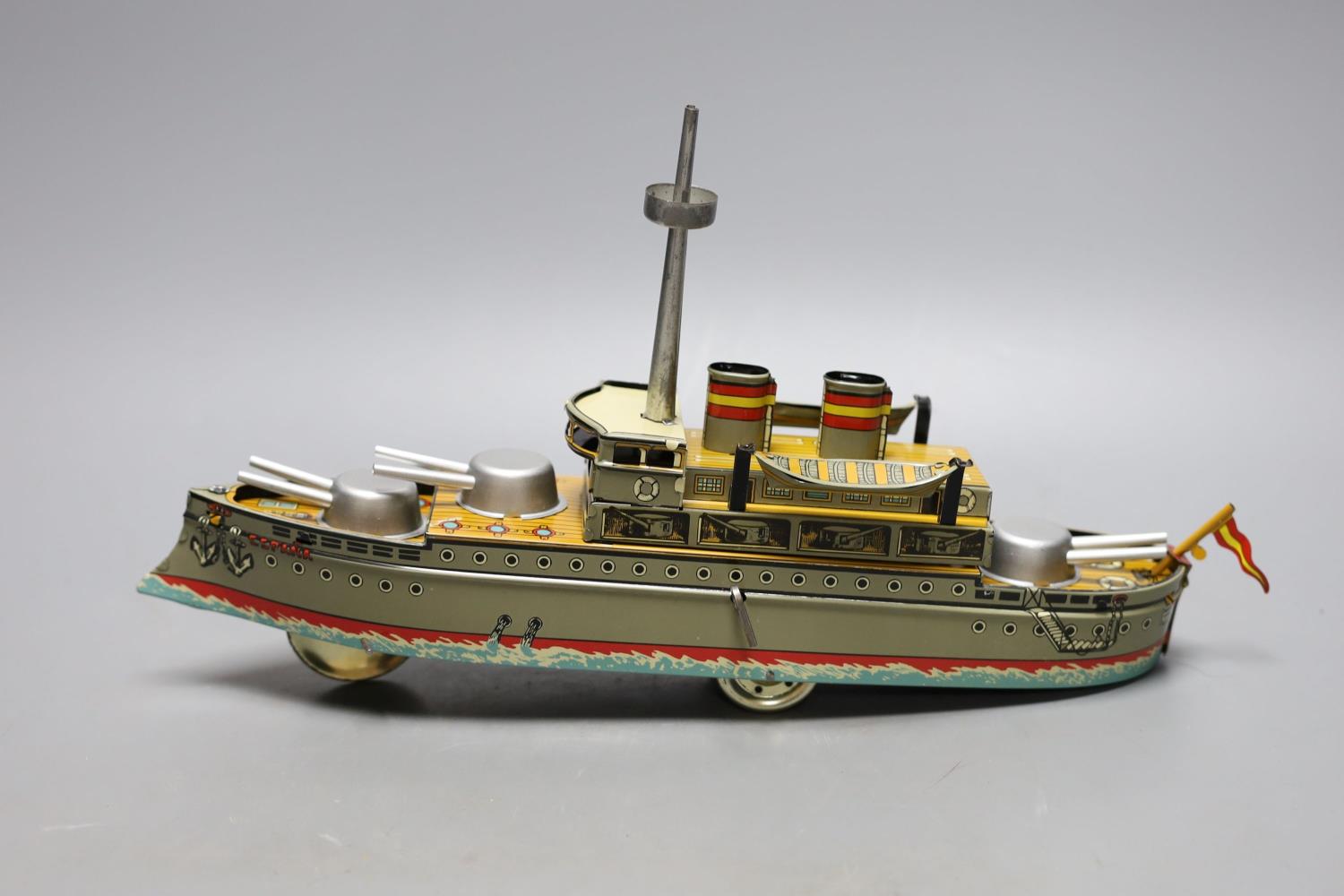 Three IBA tinplate boxed toys, two boats and a train,largest boat 42 cms wide.