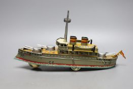 Three IBA tinplate boxed toys, two boats and a train,largest boat 42 cms wide.