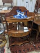 A George III mahogany bow front three tier corner washstand, width 58cm, depth 38cm, height 99cm