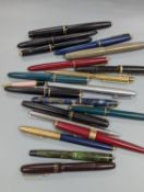 A quantity of fountains pens and pen parts