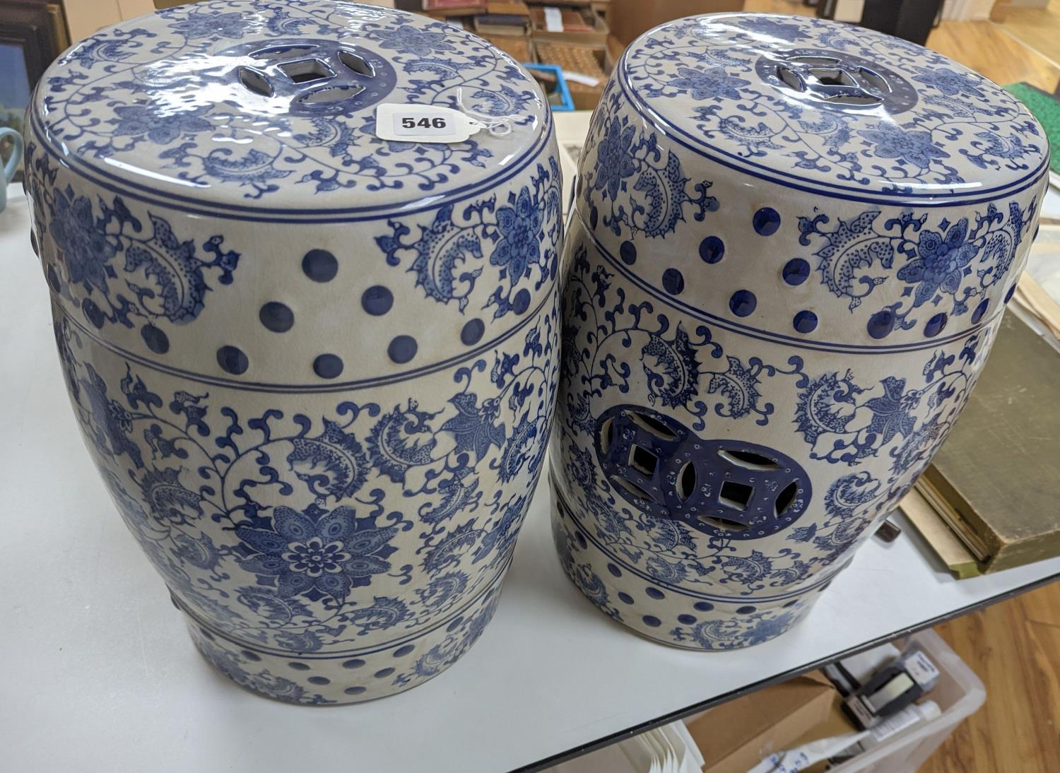 A pair of Chinese blue and white garden seats, 44 cms high.