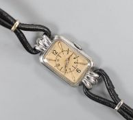 A lady's Art Deco steel Jaeger Le Coultre manual wind wrist watch, on fabric strap.